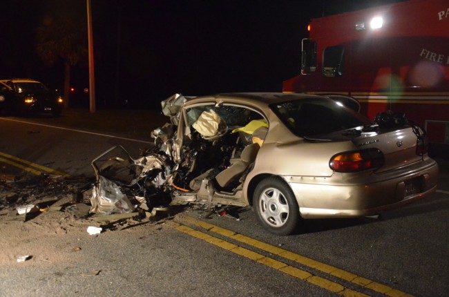 The Malibu after the extraction, which required paramedics to shear off the door and other parts of the vehicle. Click on the image for larger view. (© FlaglerLive)