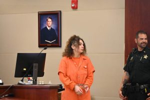 Taylor Manjarres looked toward her family before being ushered out of the courtroom. She was not allowed to have more than brief visual contact. (© FlaglerLive)