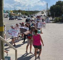 Some of the 150-some participants at today's Women's March in Flagler Beach. (© FlaglerLive)