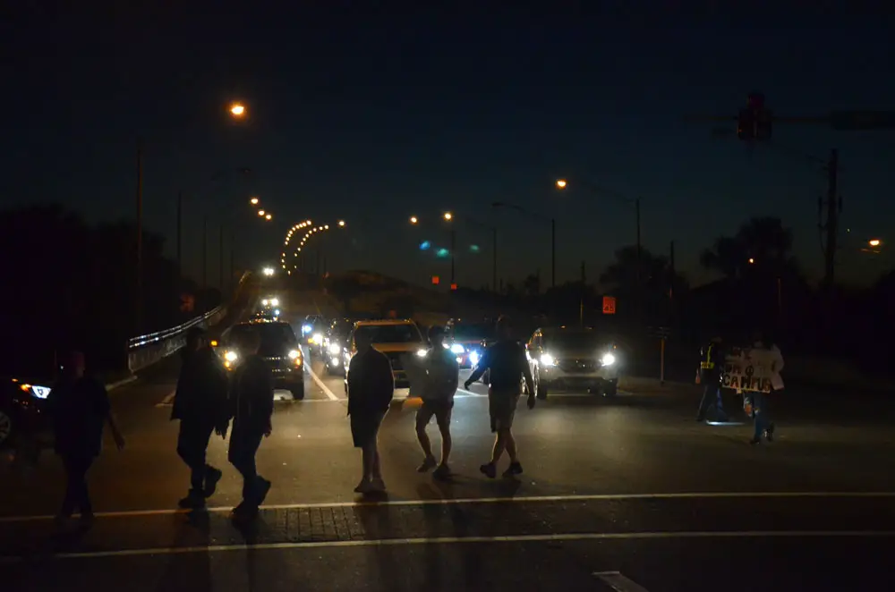 Marchers heading to a vigil at veterans P{ark in Flagler Beach in March 2018, after the massacre at the high school in Parkland. A vigil is planned Friday, after the massacres in Buffalo and (© FlaglerLive)