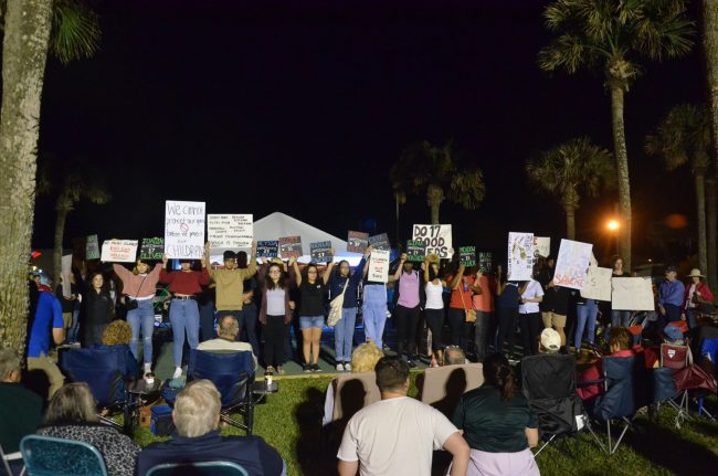 The students' march ended at Veterans Park during First Friday, where the names of the 17 victims of the Parkland massacre were read out loud as students held signs of the the names of those killed. Click on the image for larger view. (© FlaglerLive)