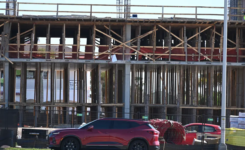 Construction of the Margaritaville Hotel in the heart of Flagler Beach as it stood at the end of January. Any new impact fees levied by the city would not apply to the hotel. (© FlaglerLive)
