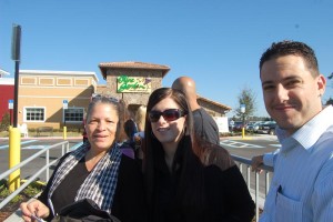 Cross-cut of hope: from left, Maria Mays of Flagler Beach and Nicole Marlin and Rob Davis, both of Palm Coast. Click on the image for larger view. (FlaglerLive)