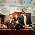 Marshall Tomas in court with his attorney, Matthew Maguire. (© FlaglerLive via zoom)