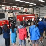 Flagler Beach City Manager Dale Martin speaking to the press at the Flagler Beach Fire Department this afternoon. Mayor Patti King was to the right. (© FlaglerLive)