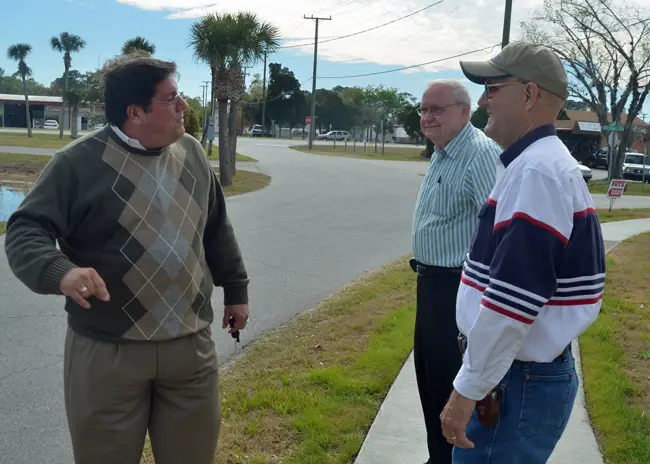 Armando Martinez, left, speaking with Elbert Tucker on Bunnell's Election Day in March 2013, when Tucker was re-elected and Bill Baxley, center, was elected, thus sealing Martinez's fate. (© FlaglerLive)