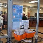 Mask stations like this one, along with mask and vaccine messaging, have sprouted in local government buildings in a reflection of a more concerted recent effort to encourage residents to mask and take precautions against the spread of the delta variant of the coronavirus. (© FlaglerLive)