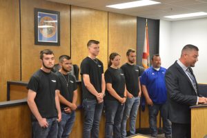 Jeremy Ossler, the Matanzas law flagship coach, with the team of students from the construction flagship, and teacher Vinnie Oliveri, who built the courtroom. Click on the image for larger view. (© FlaglerLive)