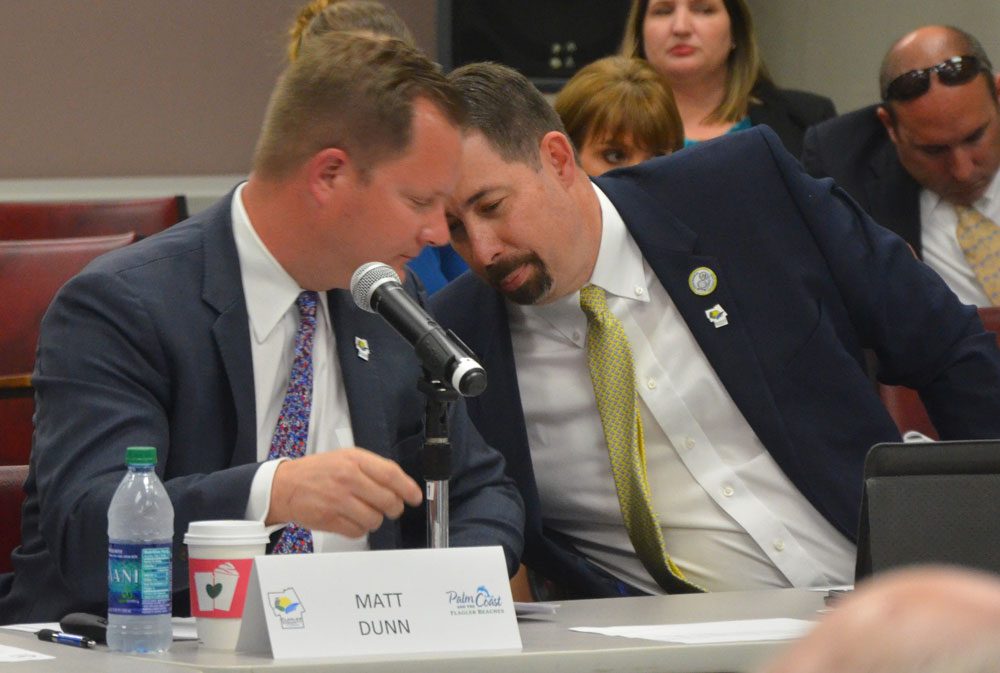 Matt Dunn, left, and former County Administrator Craig Coffey had each others' ears. (© FlaglerLive)