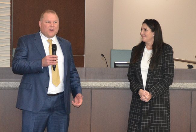 Matthew Morton speaking to a small crowd in the meet-and-greet the city organized when the finalists were being interviewed last week. Mayor Milissa Holland is to the right. (© FlaglerLive)