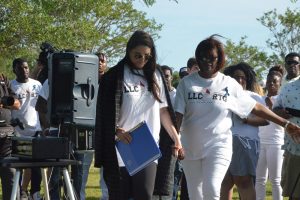 Palm Coast Mayor Milissa Holland with Curtis Gray's mother, Carmen, shortly before the cypress tree dedication in Curtis's memory. Click on the image for larger view. (© FlaglerLive)