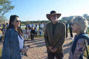 Mayor Milissa Holland with artists Harry Messersmith and Copper Tritscheller before the unveiling. (© FlaglerLive)