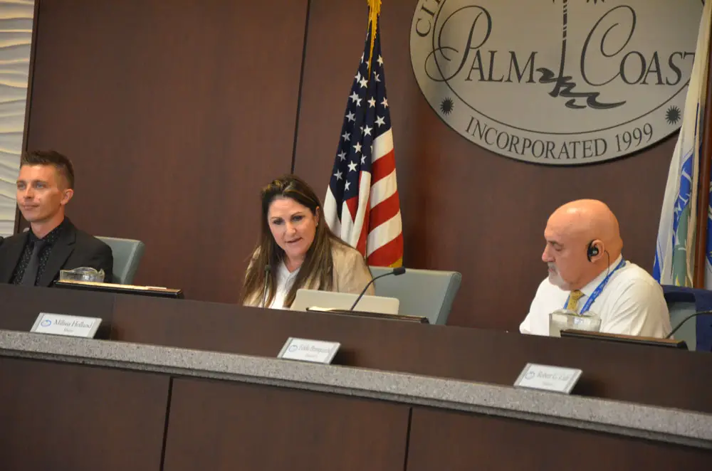 Mayor Milissa Holland anchored a 90-minute segment at Monday's Palm Coast City Council meeting, devoted entirely to refuting allegations about the city's relationship with Coastal Cloud, and the mayor's role. The mayor is a company employee. (© FlaglerLive)