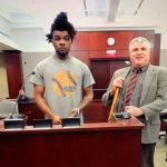 La Darrien McCaskill, left, with his attorney, Scott Westbrook. (© FlaglerLive via zoom)