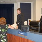 Student Board Member Ryan McDermott, center, speaking with Jacob Oliva, an unidentified woman, and Andy Dance at a School Board meeting in 2010. Oliva went on the become a superintendent here, the Florida Chancellor of Education, and is now the education secretary in Arkansas. Dance served on the School Board for over a decade before election to the County Commission. McDermot went on to the Massachusetts Institute of Technology (MIT), and has been a mechanical engineer in Massachussetts. (© FlaglerLive)