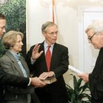 Lt. Gov. Buddy MacKay takes the oath of office to become governor of Florida in 1998. His wife Anne and his son John joined him. Florida Supreme Court Justice Charles Wells swears MacKay in at the Capitol. (Photo via State Library of Florida)