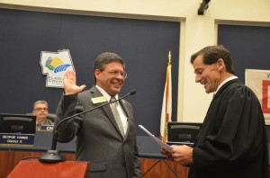 Judge Dennis Craig administers the oath for Nate McLaughlin. (© FlaglerLive)