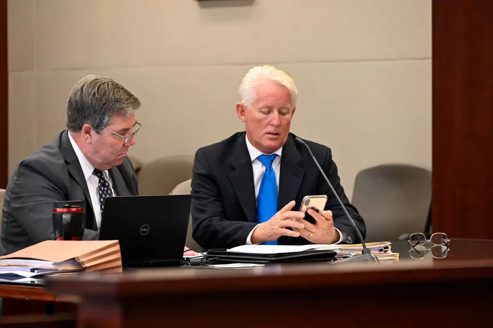 Terry McManus, right, with his attorney, Assistant Public Defender Bill Bookhammer. This morning, McManus pleaded no contest to a misdemeanor charge of falsifying a police report and the prosecution in exchange dropped a felony fraud case against him. It was scheduled for trial this morning. (© FlaglerLive)
