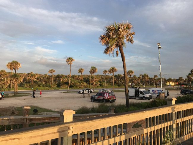 More media than news as rescuers continue the search for two people aboard a lost plane near Marineland this morning. (© FlaglerLive)