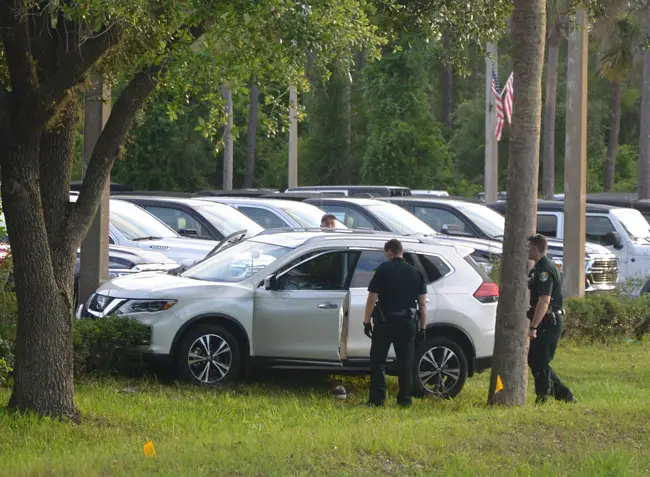George J. Serafino's Nissan did not suffer significant damage after it veered off State Road 100 in Palm Coast and crashed into a concrete pole. (© FlaglerLive)
