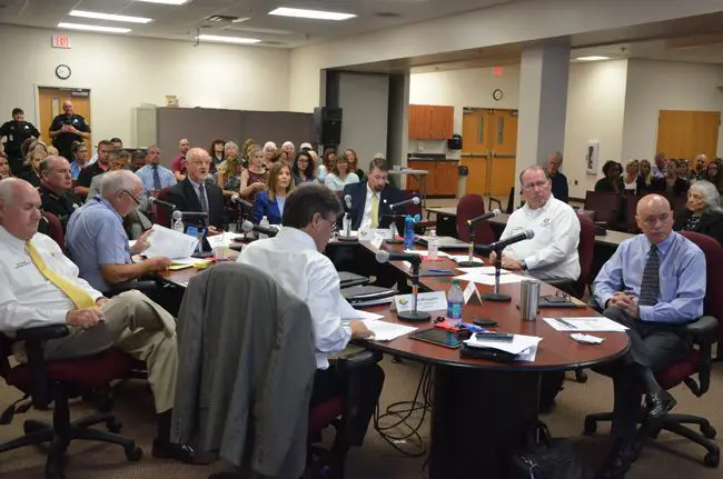 The Flagler County Commission, with Sheriff Rick Staly at the table, listens to Zdenek Hejzlar, the engineer hired to test the Sheriff's Operations Center this morning. (c FlaglerLive)