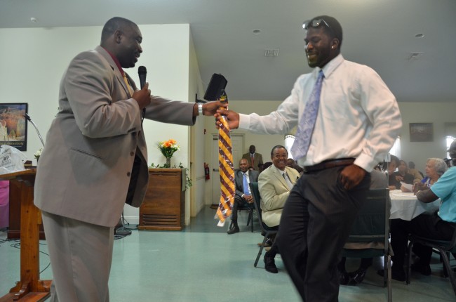 Steven Moseley Jr., a 12th grader at Matanzas High School, earns himself a Bethune-Cookman tie for guessing the right answer to a question--about Bethune-Cookman--posed by the keynote speaker, Rev. Ryan Griffin, Thursday evening. (c FlaglerLive)