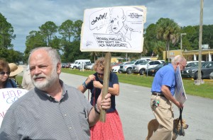 Democratic Club President Merrill Shapiro organized the demonstration. Click on the image for larger view. (© FlaglerLive)