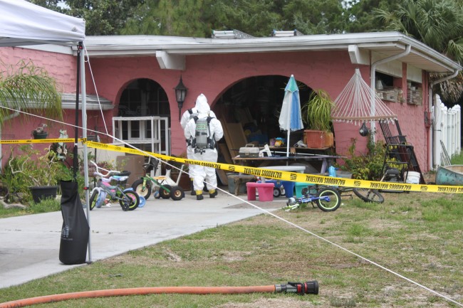 Hazmat personnel at work. Click on the image for larger view. (Sheriff's Office)