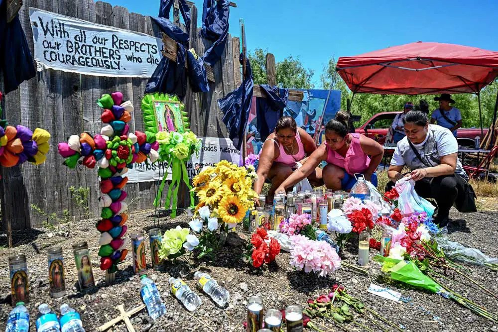 A makeshift memorial where a tractor-trailer was discovered with 53 dead migrants inside, near San Antonio, Texas, June 29, 2022. 