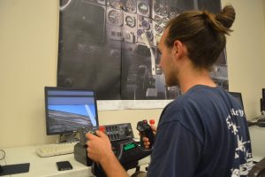 Micah Iverson, a  Teens-in-Flight student, takes off at the school's simulator. (© FlaglerLive)