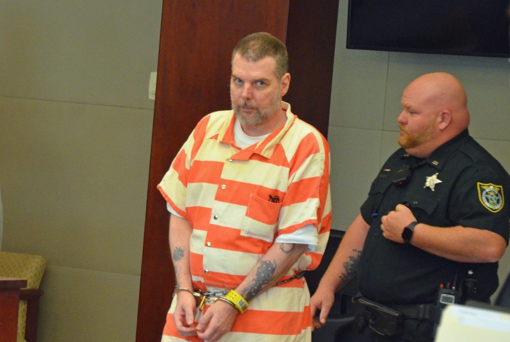 Michael Cummings in court today. Deputy Brian Sheridan is to the right. (© FlaglerLive) 