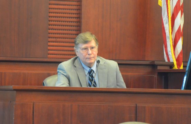 Michael Lambert, one of the region's shrewdest attorneys, in the witness box today. (© FlaglerLive)