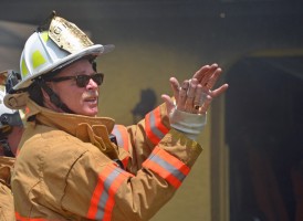 Palm Coast Fire Chief Mike Beadle in command at a fire in July 2013. Click on the image for larger view. (© FlaglerLive)