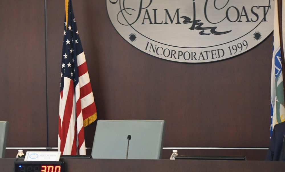 Palm Coast Mayor Mike Norris's chair was empty for the duration of the City Council's eight-hour workshop Tuesday. The meeting went very well. (© FlaglerLive)
