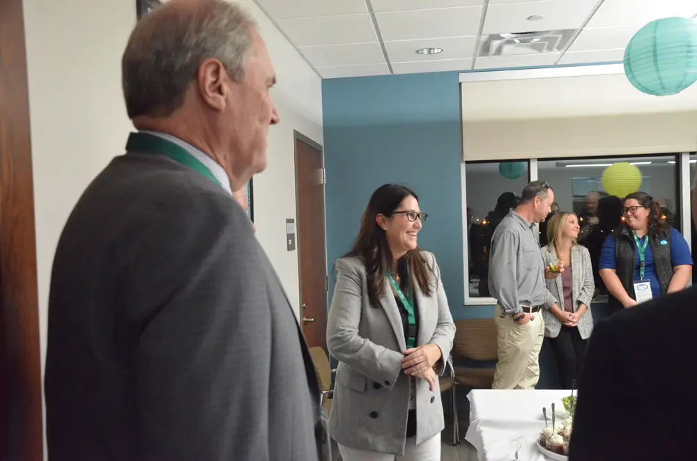Palm Coast Mayor Milissa Holland at the city's first Beach Techathon last January, where University of North Florida President David Szymanski, left, was a guest. Holland says she would focus part of her second term on establishing a UNF presence in Palm Coast. (© FlaglerLive)