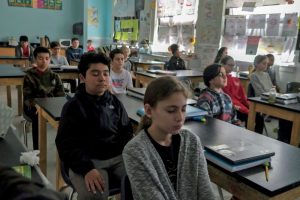 Sixth grade students start their science class with five minutes of meditation at George Washington Middle School in Alexandria, Va.