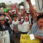 Members of St. Paul’s Hmong community protest in 1998 after a local radio host said on air that Hmong immigrants needed to ‘assimilate or hit the goddamn road.’