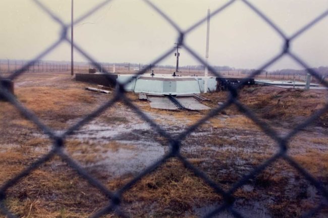 Missile silo B-13, near Olga and Walhalla, a few miles from Virginia Lillico’s house. The concrete-and-steel vault is designed either to slide or be blown open when its missile is ready to go. This silo’s Minuteman ICBM was shipped to another location in the early 1990s. (© FlaglerLive)