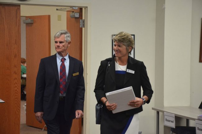 Ready to take the reins of her interview last week, Cathy Mittelstadt walked into the meeting room with the board with Bill Vogel, one of three Florida School Board Association consultants who helped the Flagler school board through the selection process. (© FlaglerLive)