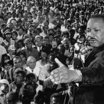 The Rev. Martin Luther King Jr. addresses a cheering crowd in Cleveland, Ohio, on July 27, 1965. (Bettmann/Getty Images)