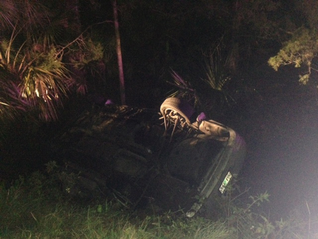 It is not yet known who was at the wheel of the Toyota when it overturned in a waterlogged ditch and killed Brianna Bellon, 23, of Palm Coast, late Sunday night. (c FlaglerLive)