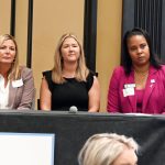 School Superintendent LaShakia Moore, right, seen here at an event in the fall of 2024, proposed to both Lauren Johnston, center, and Heidi Petito that top district positions could be a safe landing form them. Johnston took her up on it. (© FlaglerLive)
