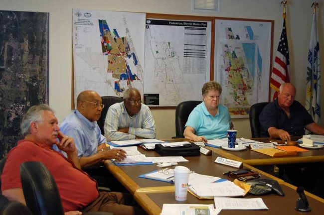 The Palm Coast City Council Moorman loved: from left, Frank meeker, Moorman, Bill Lewis, Mary DiStefano, and Mayor Jon Netts. (© FlaglerLive)