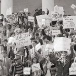 Students organized by the Moral Majority organization rally on the steps of the Capitol in Washington in 1984 in support of school prayer.