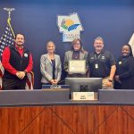 Debra Morgan, center, with members of the Tourist Development Council. From left, Oceanside Bar and Grill co-owner John Lulgjuraj, Flagler Beach Commissioner Eric Cooley,