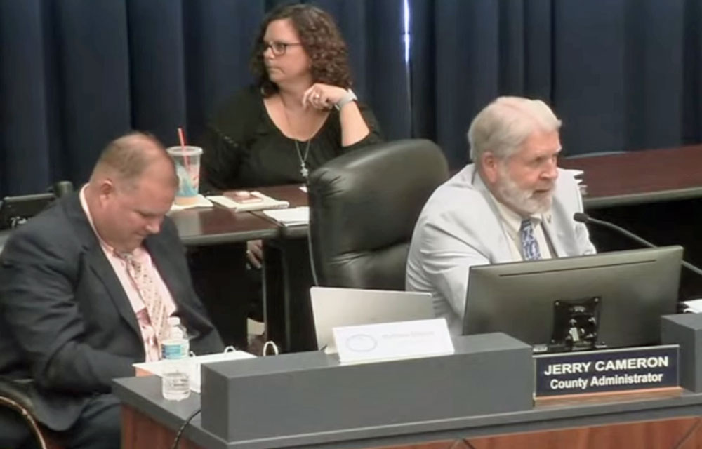 County Administrator Jerry Cameron, right, had invited Palm Coast City Manager Matt Morton to a county commission meeting in July 2019, a few months into either man's tenures in their jobs. Cameron is now being discussed as an interim replacement for Morton, who resigned this week. (© FlaglerLive via Flagler TV)