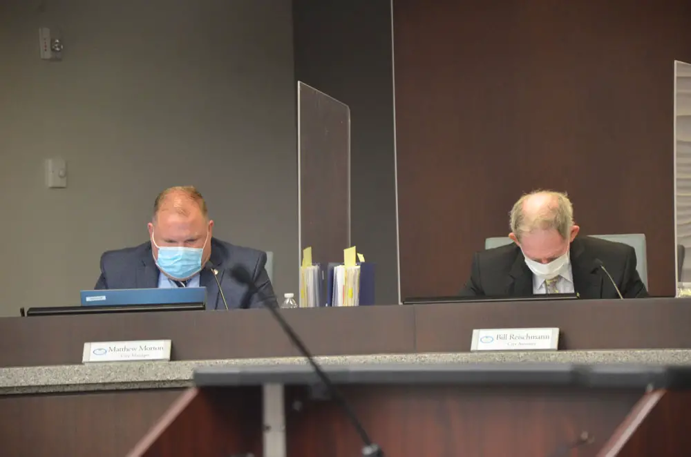 City Manager Matt Morton, left, and City Attorney Bill Reischmann, who's had a few occasions for anguish over council members' exchanges since November. (© FlaglerLive)