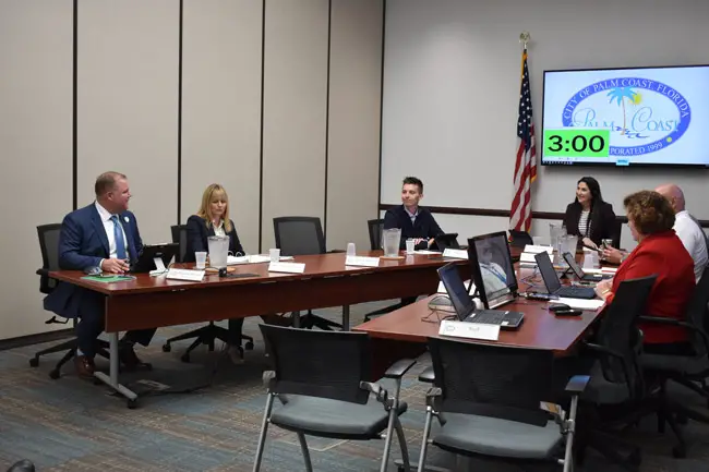 Matt Morton's first day: the new city manager sat at the edge of the table, to the left, next to Neysa Borkhart, the attorney sitting in for City Attorney Bill Reischmann, and Council member Nick Klufas. (© FlaglerLive)