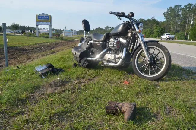 The victims' motorcycle after it was righted by the side of U.S. 1 this afternoon, with some of the victims' belongings still at the scene. Click on the image for larger view. (© FlaglerLive)