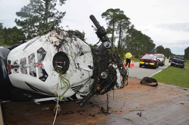 The motorcycle scraped the pavement before ending up in the grassy shoulder. Click on the image for larger view. (© FlaglerLive)